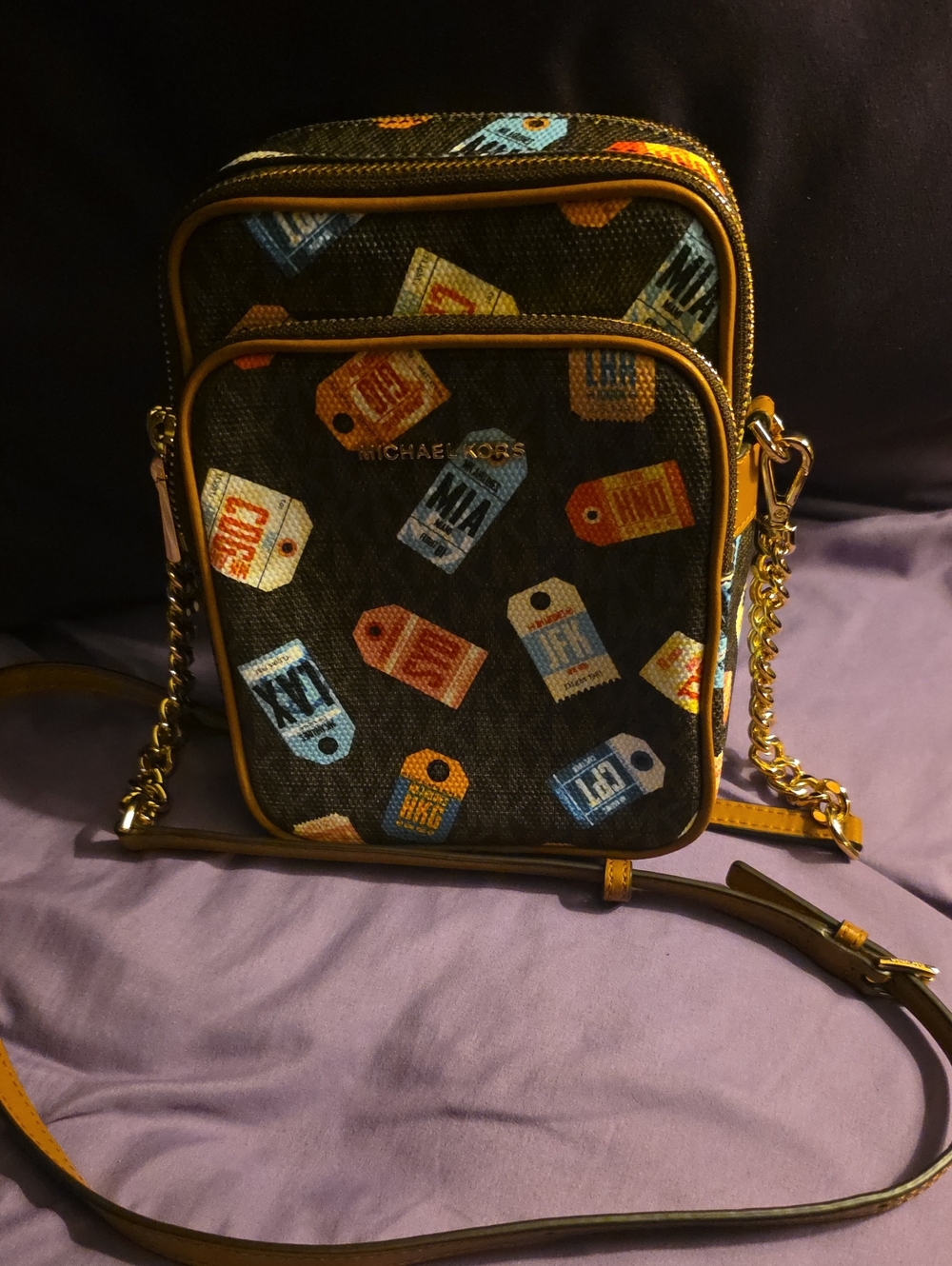 Michael Kors Black Crossbody Bag with Multi-Color Tag Print and Gold Hardware